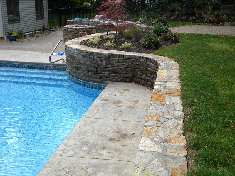 Swimming pool and stamped concrete project example 192